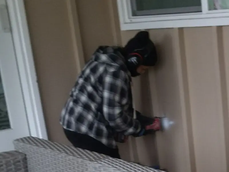 Professional electrician installing an exterior outlet in Mingo Junction