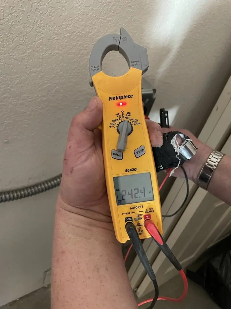 Voltage testing with clamp meter during Circuit Breaker Repair in Mingo Junction